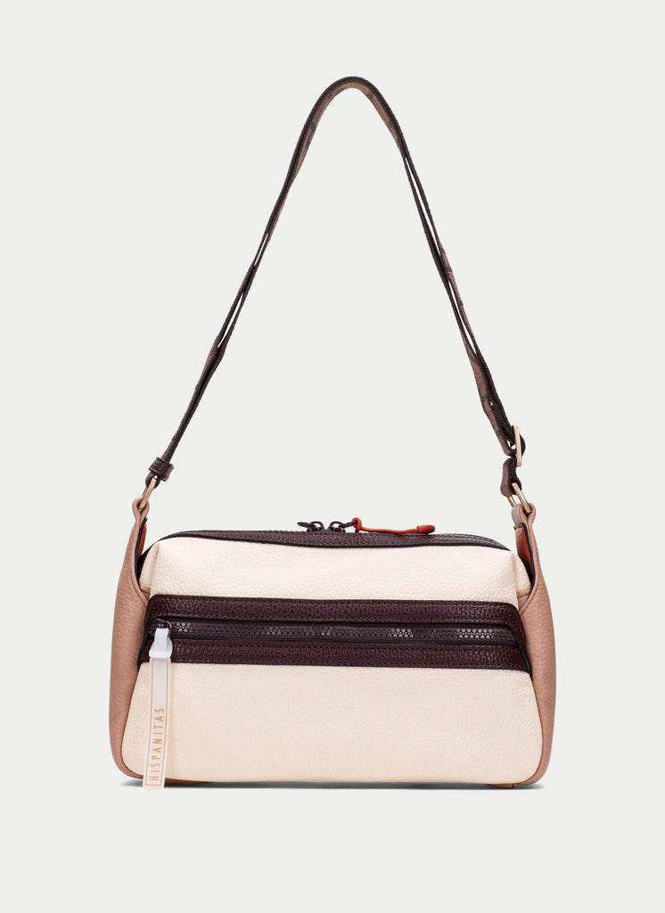 Two-tone handbag with beige and brown colors on a light gray background
