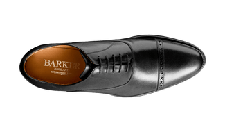 Black leather dress shoe on a transparent background