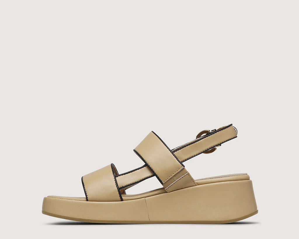 Beige sandal on a light beige background