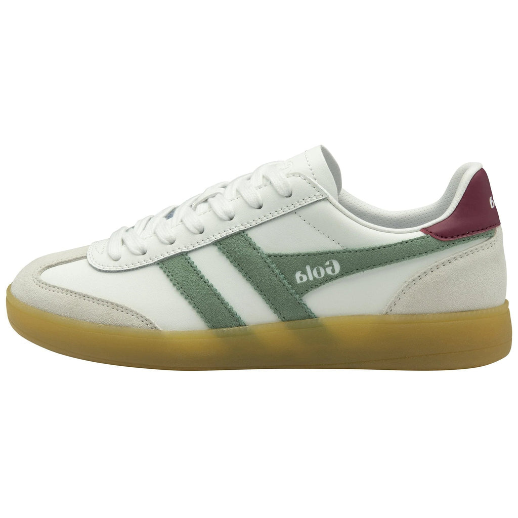 White sneaker with green accents and brown sole on a white background