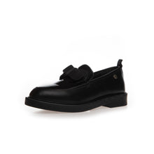 Load image into Gallery viewer, A single black leather loafer with a decorative bow detail across the vamp and a low block heel, shown from a side profile on a white background.
