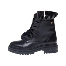 Load image into Gallery viewer, A single black leather ankle boot with a ruffled collar, decorative ruffle detail on the side, and a chunky lug sole, shown against a plain white background.
