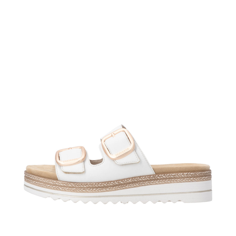 White sandal with brown straps and sole on a white background