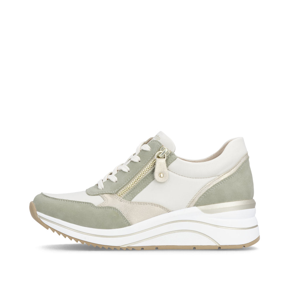 Light green and white sneaker with a small gold zipper on a white background