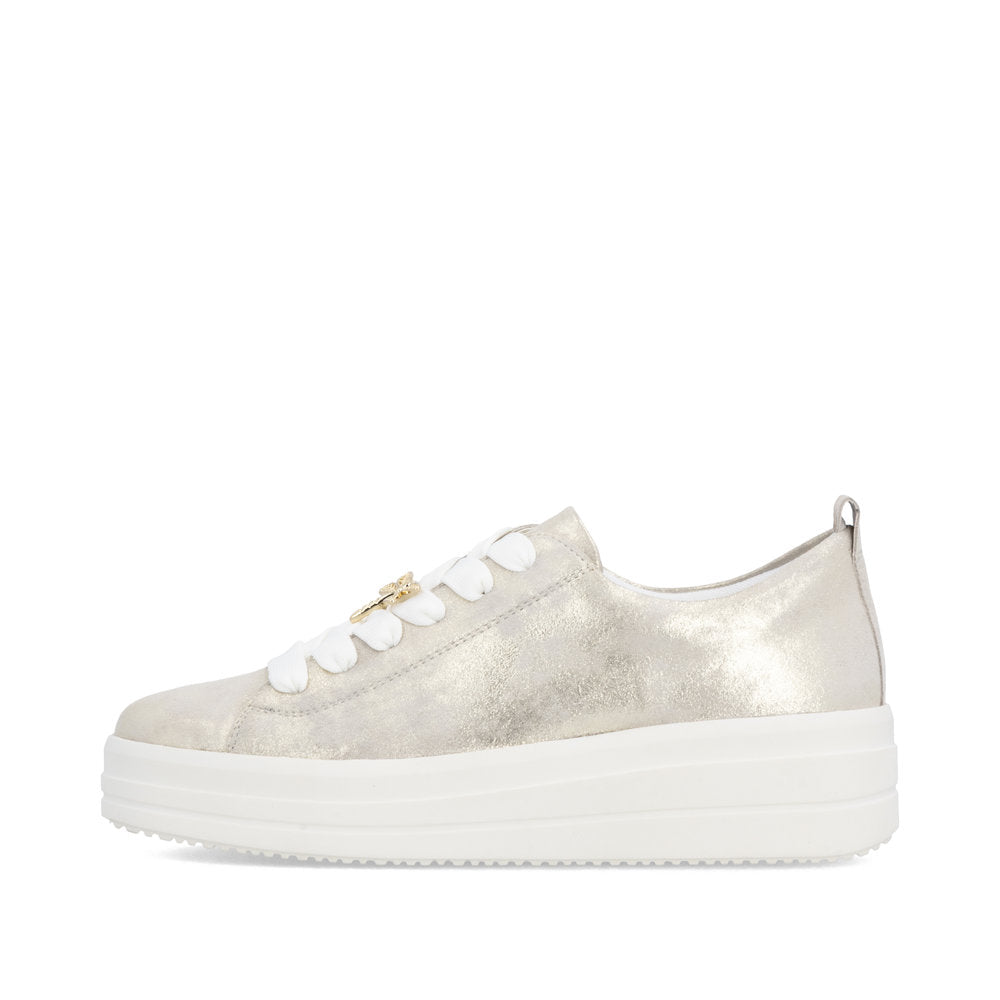 Gold sneaker with white laces on a white background