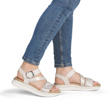 Load image into Gallery viewer, White sandals worn with rolled-up blue jeans on a white background
