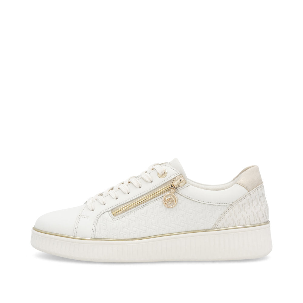 White sneaker with gold accents on a white background