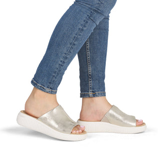 Silver sandal with a white sole on a white background