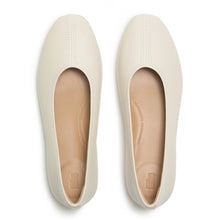 Load image into Gallery viewer, Pair of white flat shoes on a white background
