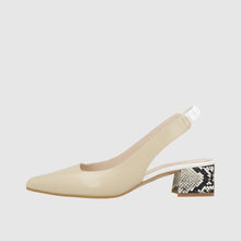 Load image into Gallery viewer, Beige shoe with a patterned heel on a white background
