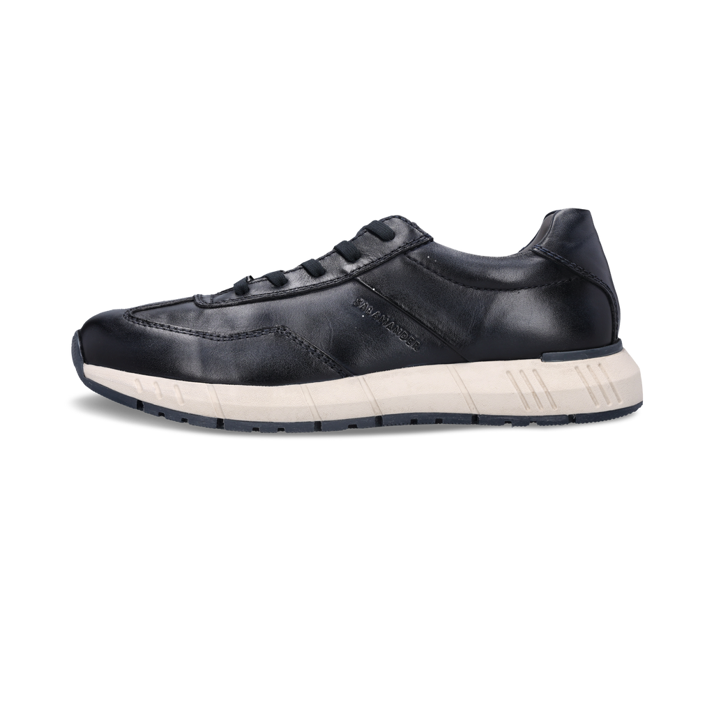 navy leather sneaker with white sole on a white background