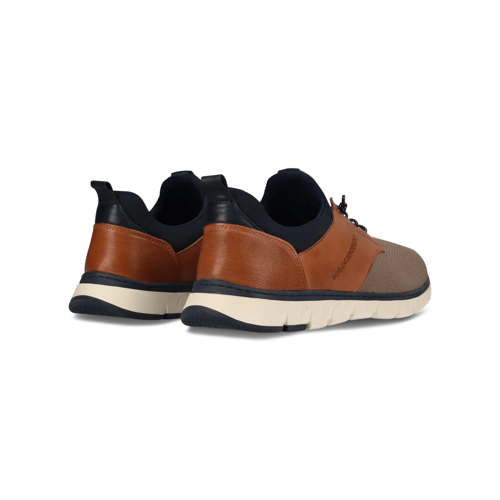 Pair of brown and black sneakers on a white background