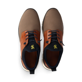 Brown and beige sneaker with black accents on a white background