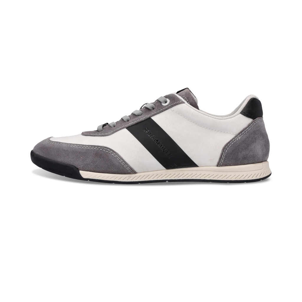 Gray and white sneaker with a black stripe on a white background