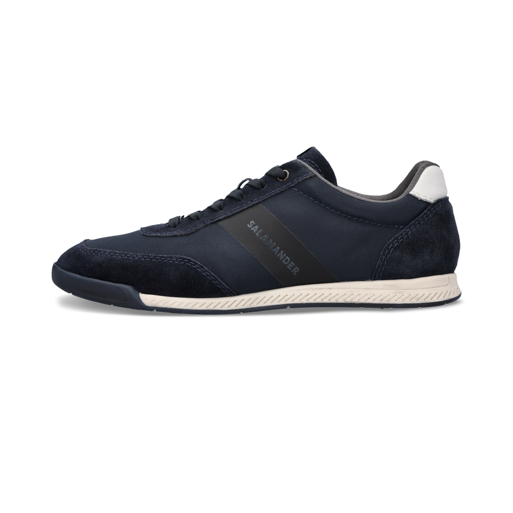 Navy blue sneaker with white sole on a white background