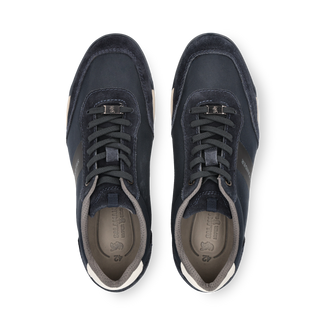 Navy blue sneaker with white sole on a white background