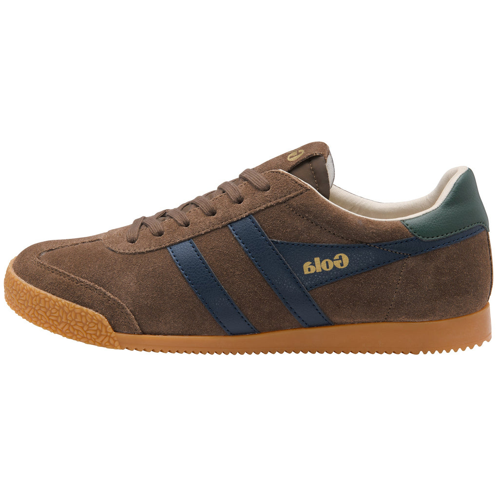 A brown suede sneaker with navy blue side stripes, a green heel tab, and a gum sole. The brand name 'Gola' is printed in gold on the side stripe.