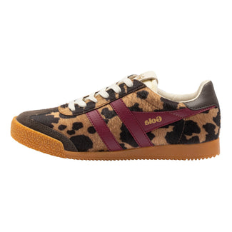 A Gola brand low-top sneaker featuring a leopard print pattern in beige, brown, and black, accented by a burgundy side stripe with gold 'Gola' lettering, white laces, and a brown gum sole.