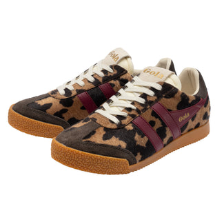 A Gola brand low-top sneaker featuring a leopard print pattern in beige, brown, and black, accented by a burgundy side stripe with gold 'Gola' lettering, white laces, and a brown gum sole.