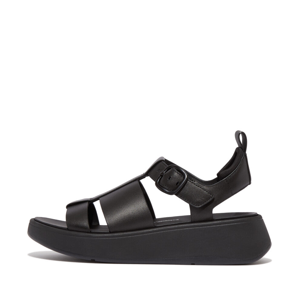 Black sandal with a platform sole on a white background
