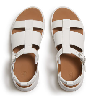 White sandal with a brown sole on a white background