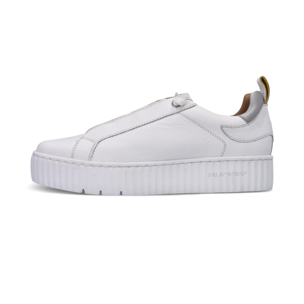 White sneaker with a thick sole on a white background