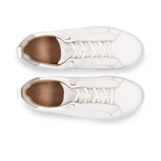 White sneaker with a thick sole on a white background