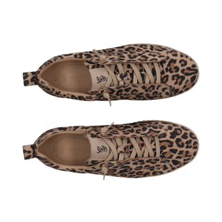 Leopard print slip-on sneaker with a thick white sole on a white background