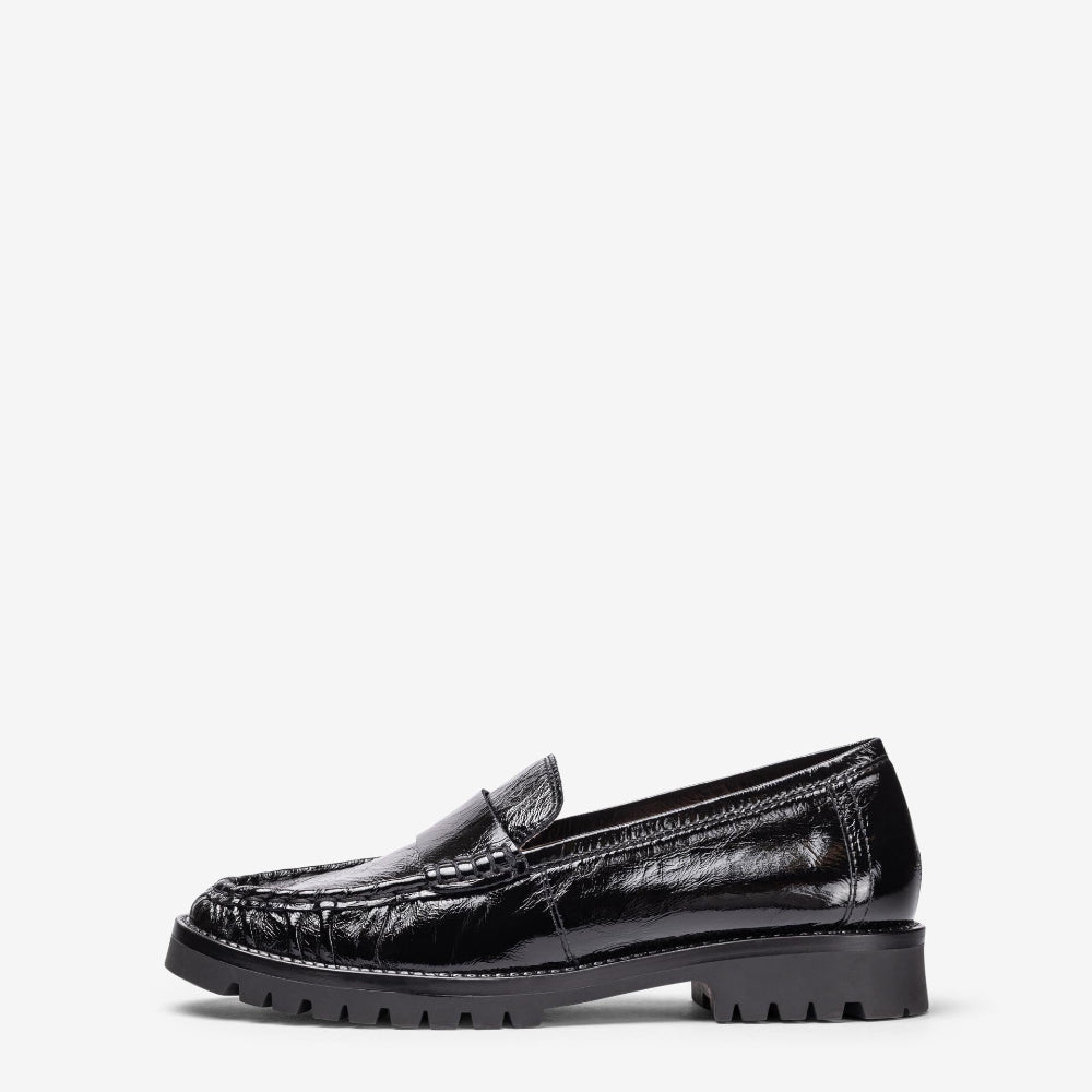 Black loafer shoe on a white background