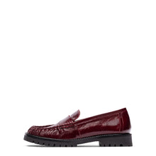 Load image into Gallery viewer, A single glossy burgundy leather penny loafer with a black lug sole, shown in profile against a solid white background.
