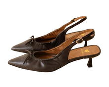 Load image into Gallery viewer, Pair of black high-heeled shoes on a beige background
