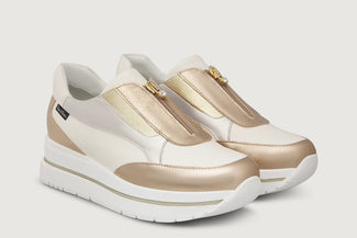 White and beige sneaker with a brand logo on a white background
