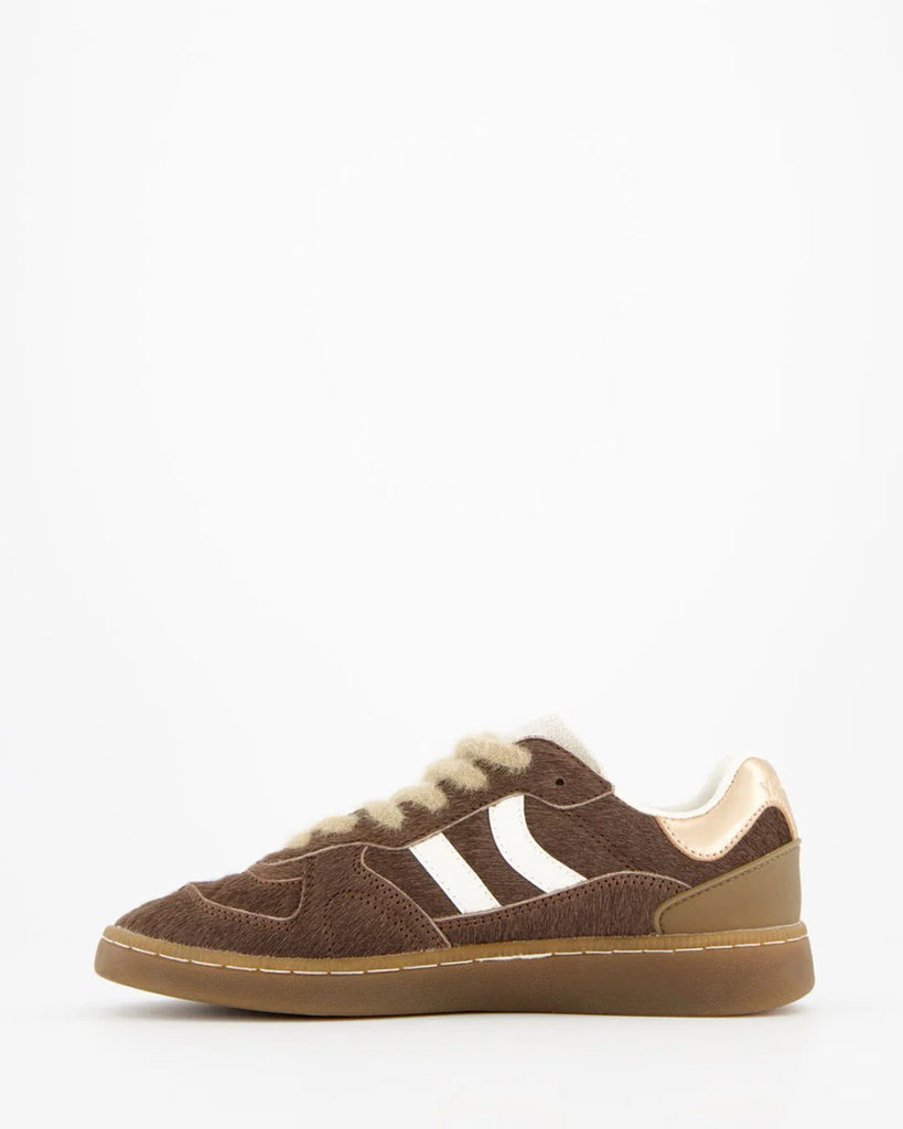 Brown sneaker with white fur lining on a white background