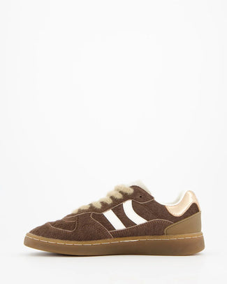 Brown sneaker with white fur lining on a white background