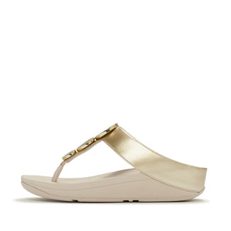 Beige sandal with a decorative strap on a white background