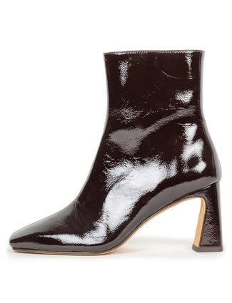 A glossy burgundy patent leather ankle boot with a block heel and pointed toe, shown from a side profile on a white background.