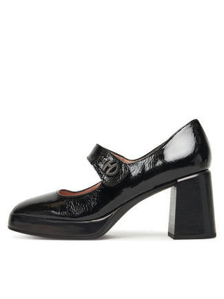 Black patent leather shoe with a block heel on a white background