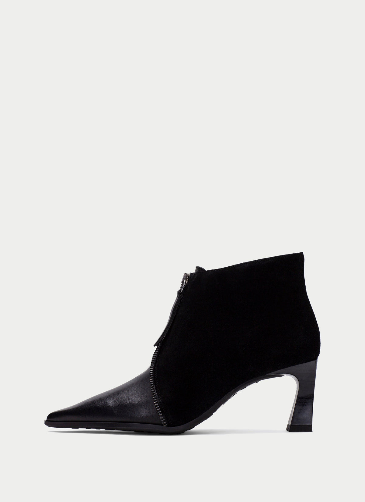 A single black ankle boot with a pointed toe, a mid-height block heel, and a side zipper, shown from a side profile on a light gray background.