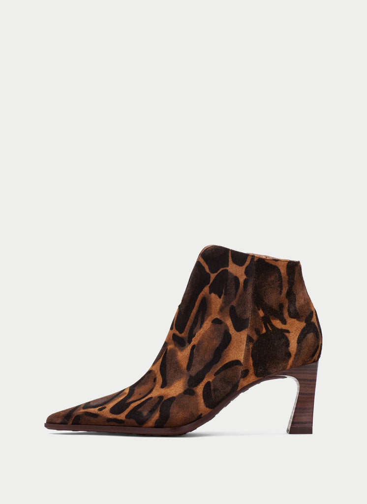 A single pointed-toe ankle boot with a brown and black leopard print pattern and a dark brown block heel, shown from a side profile on a light gray background.