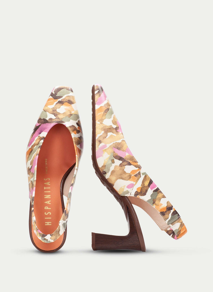 Pair of high-heeled shoes with a colorful pattern on a light gray background