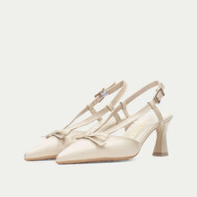 Load image into Gallery viewer, Pair of beige high-heeled shoes with bow detail on a light beige background
