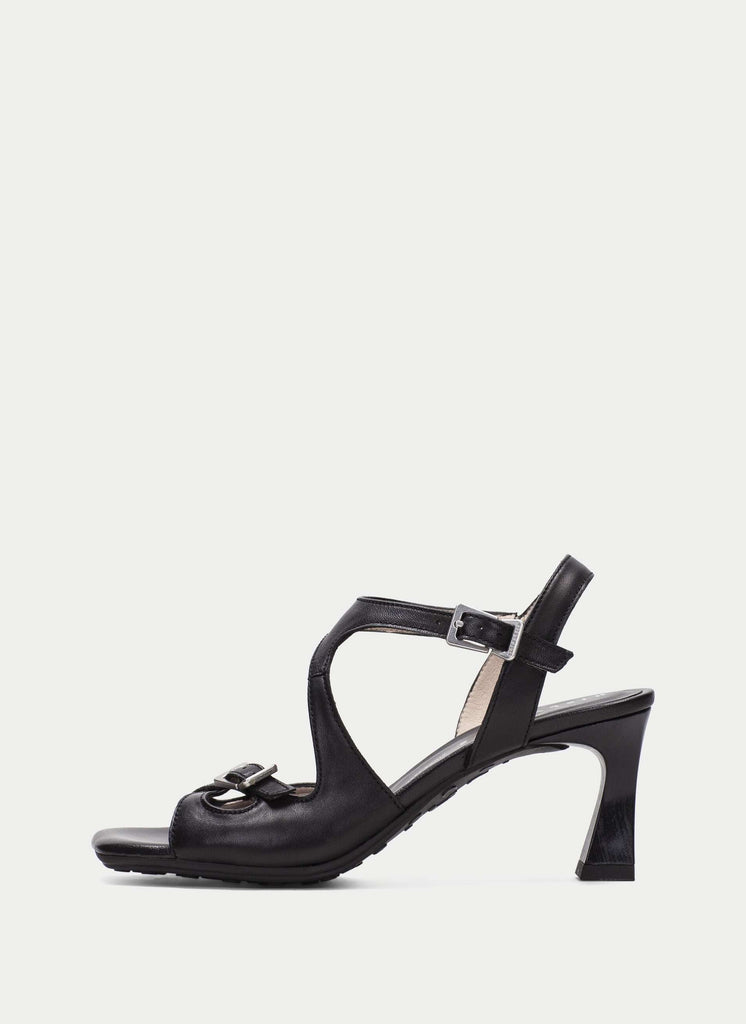 Black sandal with a high heel on a white background