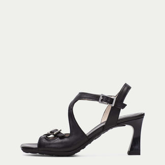 Black sandal with a high heel on a white background