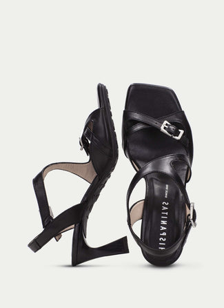 Black high-heeled sandals on a white background