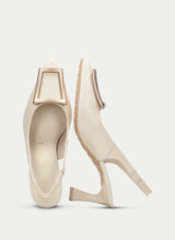 Load image into Gallery viewer, Pair of beige high-heeled shoes on a light gray background
