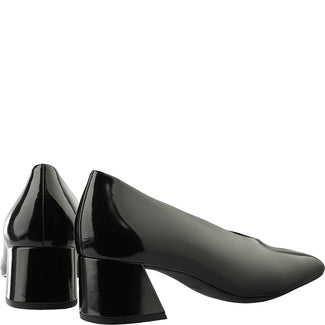 Black patent leather shoe on a white background