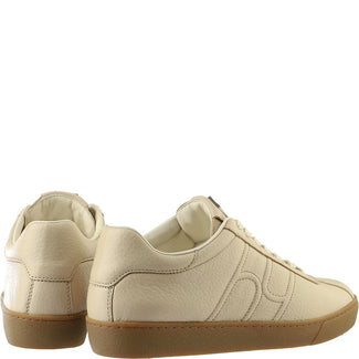 Beige sneaker with brown sole on a white background