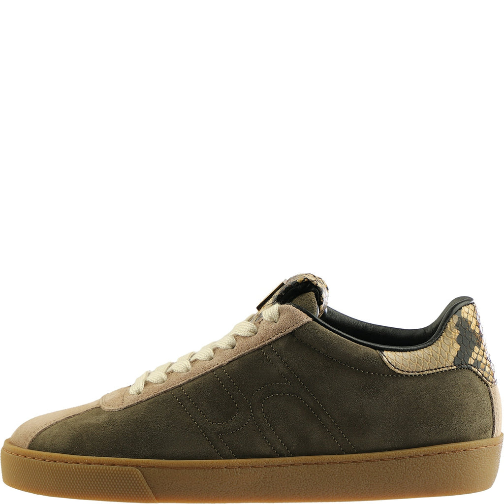 green sneaker with beige accents on a white background