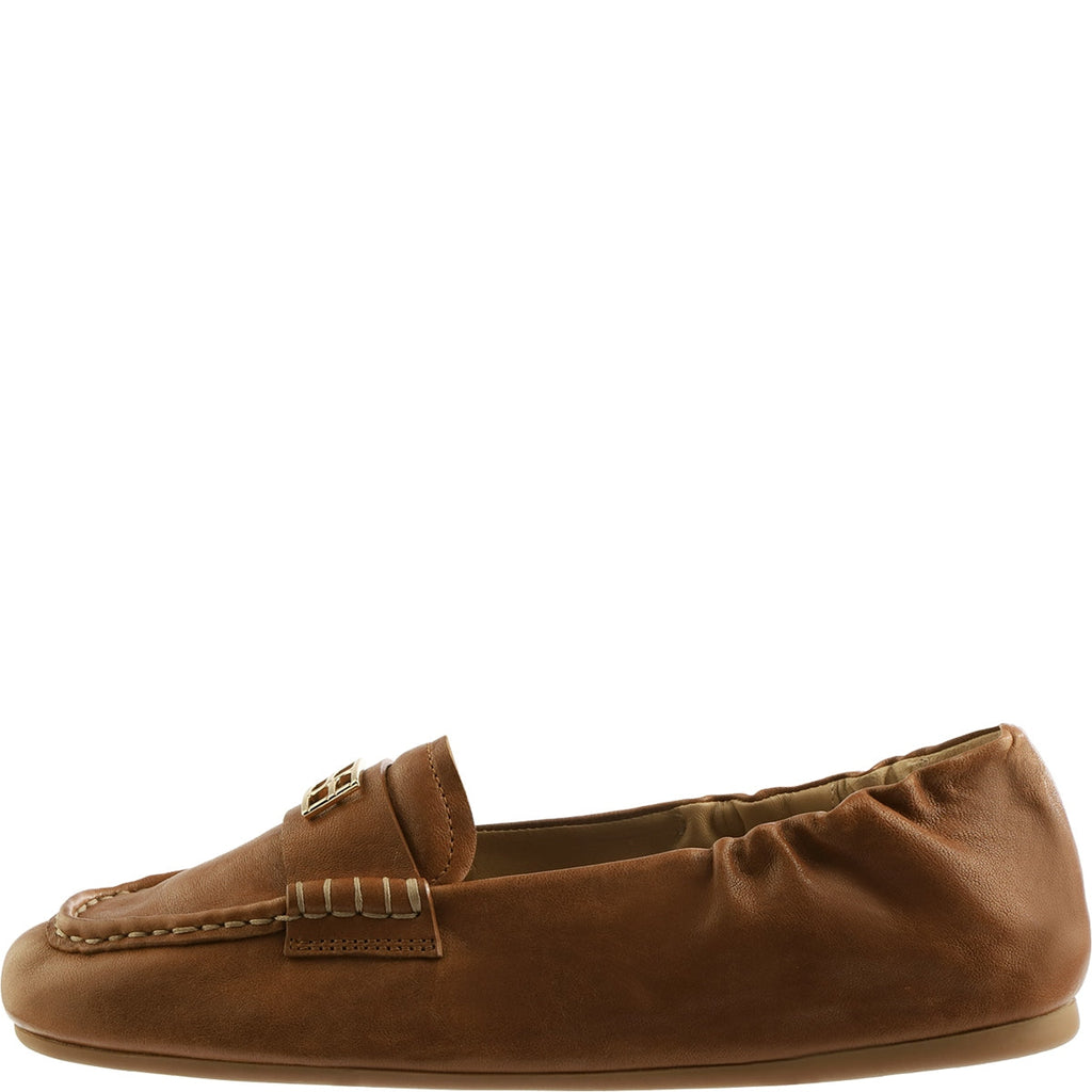 Brown leather loafer on a white background