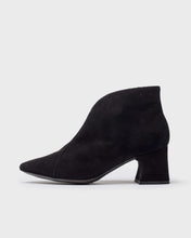 Load image into Gallery viewer, A single black suede ankle boot with a chunky block heel and pointed toe, shown in profile against a light gray background.
